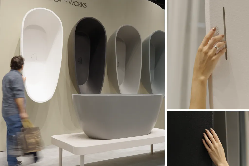 Montagem com três fotos de banheiras modernas da Doka Bath Works. À esquerda, exposição em feira com banheiras ovais suspensas na parede em cores branca, preta e cinza, além de modelos expostos em plataformas, enquanto um visitante observa. À direita acima, mão feminina com anel toca o ladrão de água em fenda estreita na lateral de uma banheira branca. À direita abaixo, mão repousa sobre a superfície externa texturizada de uma banheira preta.