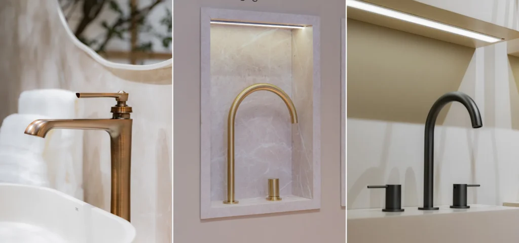 Banheiros modernos Doka 2026: três torneiras de design sofisticado — à esquerda, Monocomando para Lavatório 240mm Ever em acabamento bronze escovado sobre cuba de apoio branca com espelho redondo ao fundo; ao centro, Bica de Mesa para Lavatório 245mm Loop em dourado fosco com acionamento Loop separado, exibida em nicho iluminado com fundo em mármore rosa; à direita, Misturador de Bancada para Lavatório Loop em preto fosco com dois acionamentos cilíndricos laterais em ambiente de banheiro moderno.